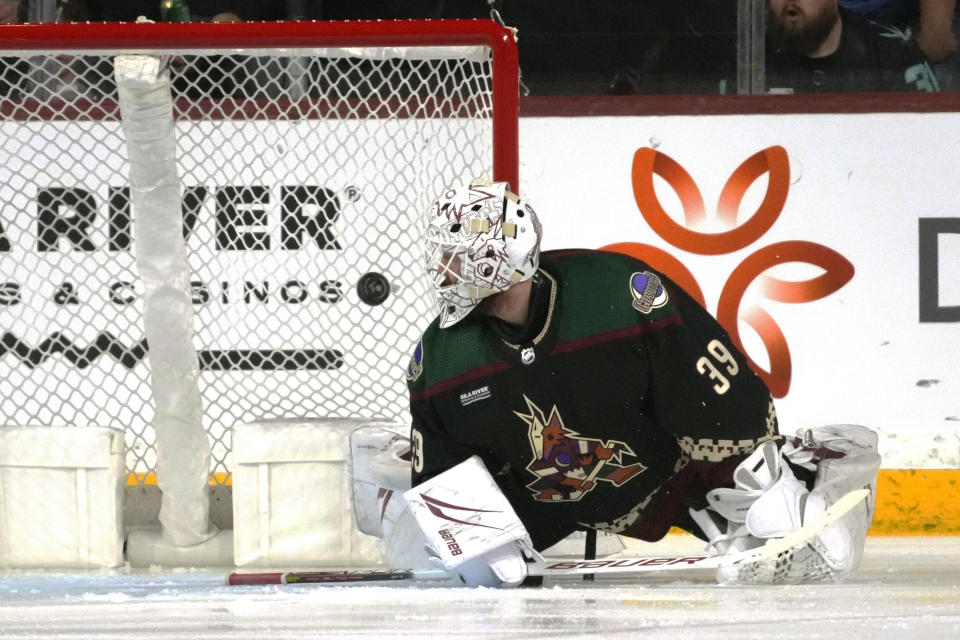 Arizona Coyotes goaltender Connor Ingram gives up a goal to Seattle Kraken' Eeli Tolvanen during the first period of an NHL hockey game Tuesday, Nov. 7, 2023, in Tempe, Ariz. (AP Photo/Ross D. Franklin)