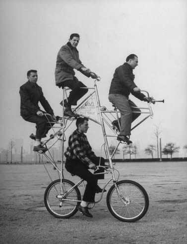 Four-man bicycle is powered by five chains and has brakes on both its wheels. The bike was built by Art Rothschild (top position) who broke three ribs while learning how to ride it. (Wallace Kirkland—Time & Life Pictures/Getty Images) <br> <br> <a href="http://life.time.com/curiosities/hell-on-wheels-in-praise-of-mutant-bicycles/#1" rel="nofollow noopener" target="_blank" data-ylk="slk:Click here to see the full collection at LIFE.com;elm:context_link;itc:0;sec:content-canvas" class="link ">Click here to see the full collection at LIFE.com</a>