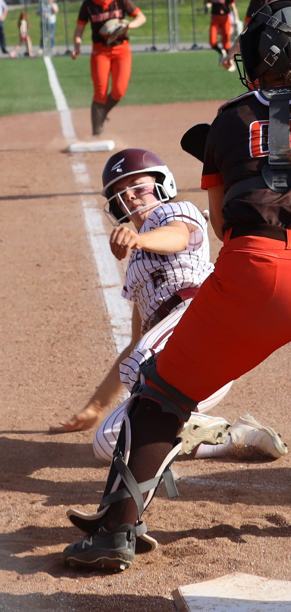 John Glenn senior Brynna 'Wheels' Wolford slides safely into home during last Wednesday's Division II sectional championship game with Meadowbrook. Wolford along with fellow seniors Abby Buchtel and Sydney Johnson have played key roles in the Lady Muskies success the last two seasons.