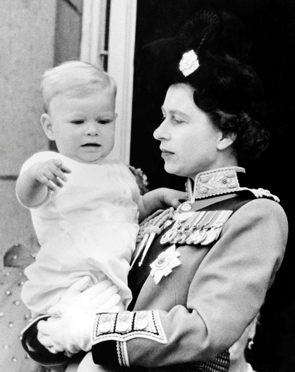 <p>The Queen and a baby Prince Andrew following the Trooping the Colour – the Queen's birthday parade. (Central Press/AFP/Getty)</p> 