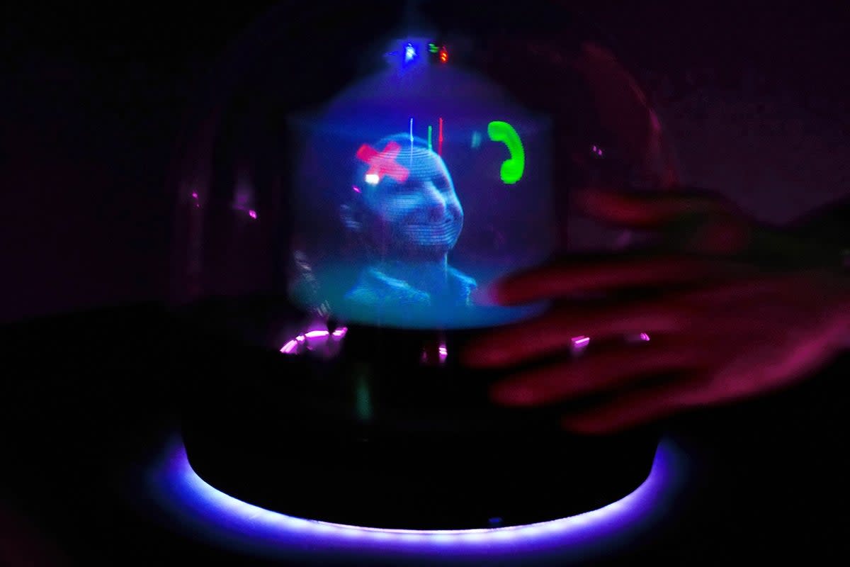 An AI-generated hologram called ‘Conceptt’ flagging a video-call is displayed at the Deutsche Telekom AG’s stand during Mobile World Congress (MWC) in Barcelona on 26 February, 2024 (Getty Images)