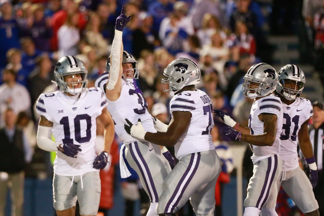 Kansas State junior tight end Ben Sinnott (34) celebrates a touchdown during the first quarter of Saturday's Sunflower Showdown against Kansas inside David Booth Kansas Memorial Stadium.