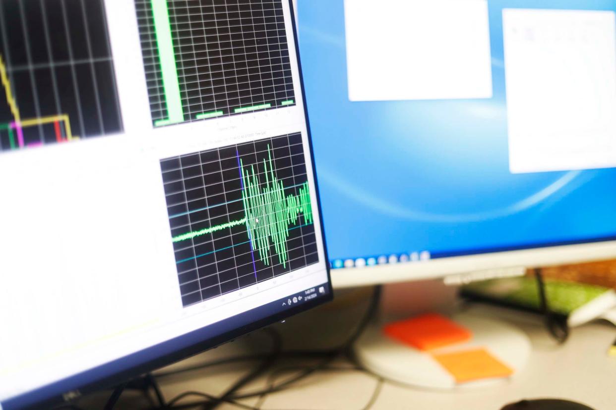 PhD student Navin Thapa explains how he interprets data to determine the magnitude of seismic activity in the Earthquake Physic Lab at the University of Memphis Center for Earthquake Research and Information on Wednesday, Feb. 14, 2024 in Memphis, Tenn.