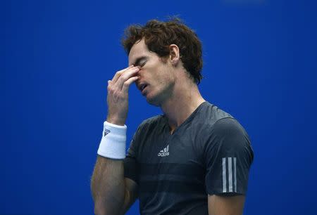 Andy Murray of Britain reacts after missing a shot during the men's singles semi-final match against Novak Djokovic of Serbia at the China Open tennis tournament in Beijing October 4, 2014. REUTERS/Petar Kujundzic