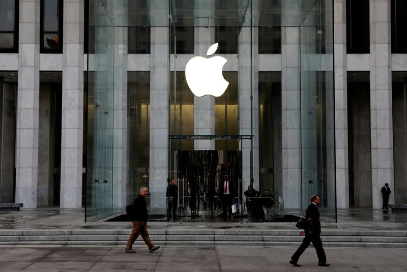 FILE PHOTO: The Apple Inc. logo is seen hanging at the entrance to the Apple store on 5th Avenue in New York