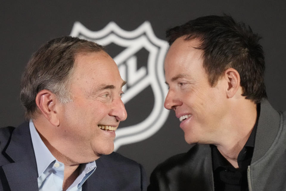 NHL Commissioner Gary Bettman, left, and Ryan Smith, co-founder and chairman of Smith Entertainment Group, speak during a news conference Friday, April 19, 2024, in Salt Lake City about the move of the Arizona Coyotes franchise to Salt Lake City. (AP Photo/Rick Bowmer)