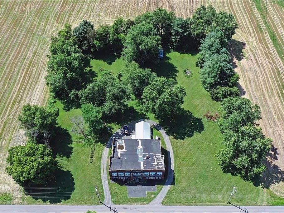 A birds-eye view of the property and the surrounding greenery.