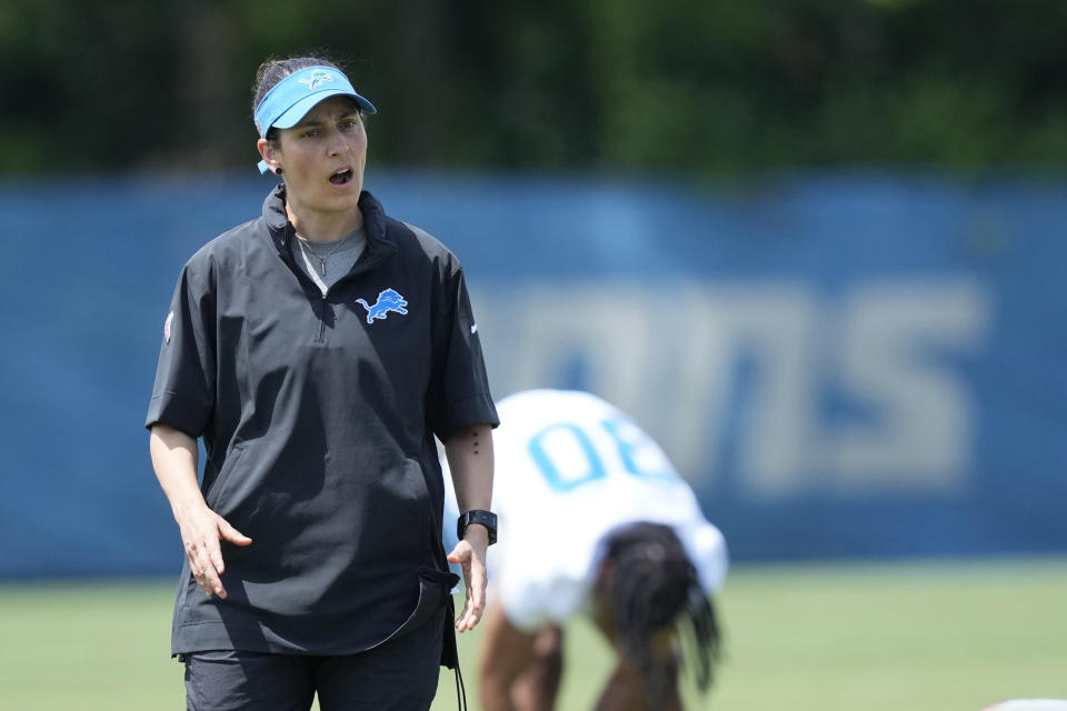 Detroit Lions Director of Sports Medicine Jill Costanza watches an NFL football practice, Tuesday, June 4, 2024, in Allen Park, Mich. Costanza’s interest in studying ACL injuries and passion for learning new ways to improve performance led the former high school basketball coach and PE teacher on a journey from college sports to the Army to the Air Force to the NFL. Now, she’s an asset for a team with Super Bowl aspirations. (AP Photo/Carlos Osorio)