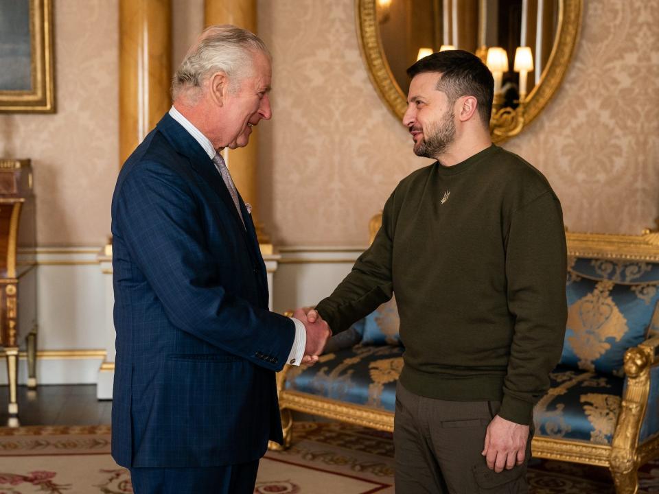 King Charles shakes hands with Ukrainian President Volodymyr Zelenskyy at Buckingham Palace on February 8, 2023.