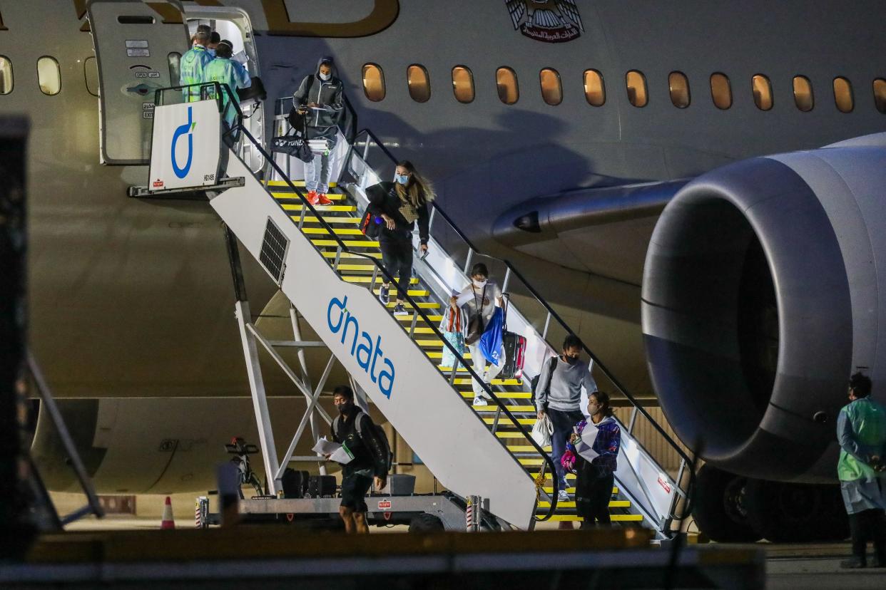 <p>Tennis players and officials arriving in Melbourne on January 14</p> (Getty Images)