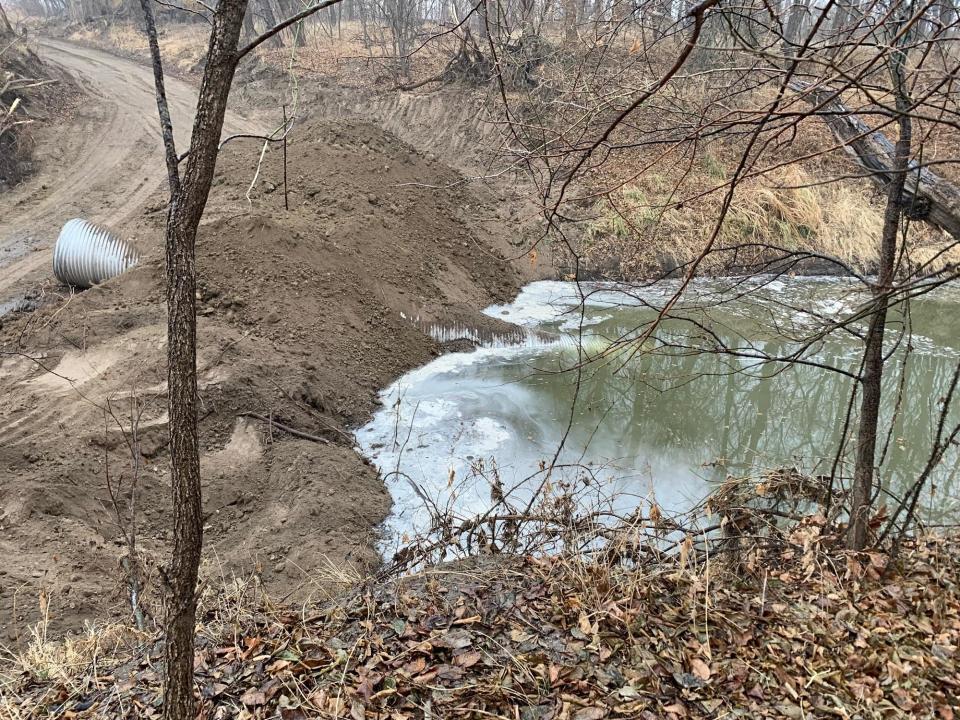 An earthen underflow dam constructed near Washington, Kansas, to prevent further migration of oil.  / Credit: U.S. EPA