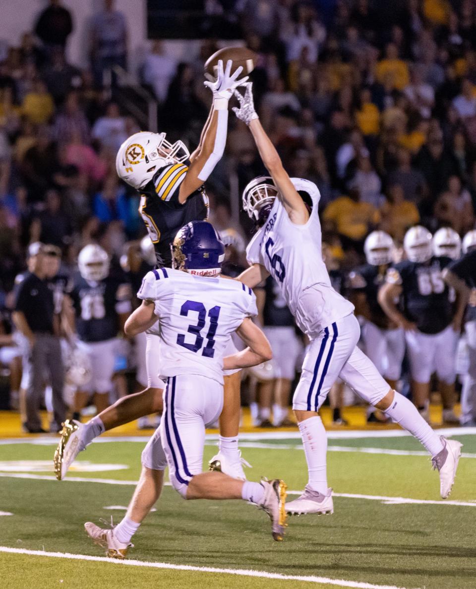 The Chiefs Paxton Wehner fights for a pass with the Lakers Spencer Mellencamp during the matchup between Kickapoo and Camdenton on September 2, 2022.