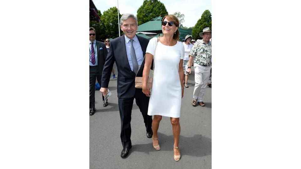 Michael Middleton in a suit with Carole Middleton in a white dress and sunglasses