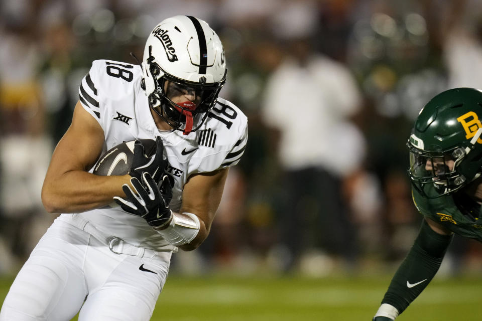 Iowa State tight end Benjamin Brahmer (18) catches a touchdown pass in front of Baylor linebacker Matt Jones, right, during the first half of an NCAA college football game, Saturday, Oct. 5, 2024, in Ames, Iowa. (AP Photo/Charlie Neibergall)