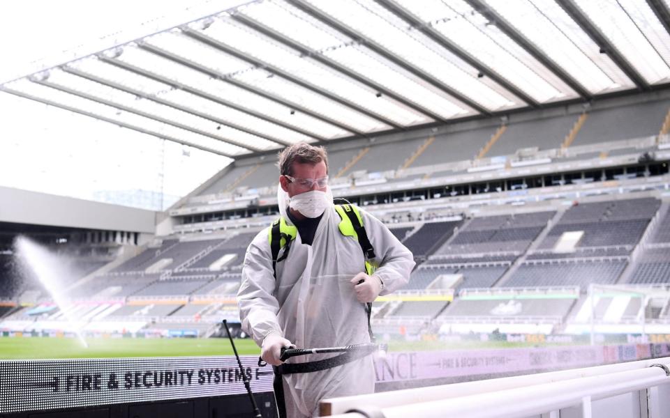 Staff disinfect areas inside St James' Park - Getty Images