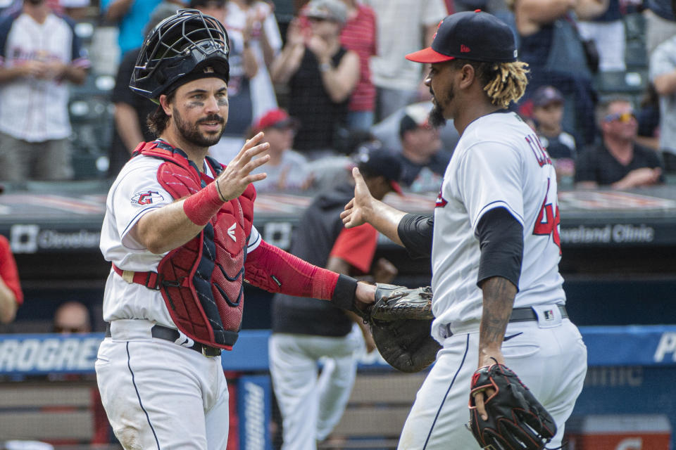 Cleveland Guardians' catcher Austin Hedges congratulates Emmanuel Clase after the final out of the ninth inning of the first baseball game of a doubleheader against the Minnesota Twins in Cleveland, Saturday, Sept. 17, 2022. (AP Photo/Phil Long)