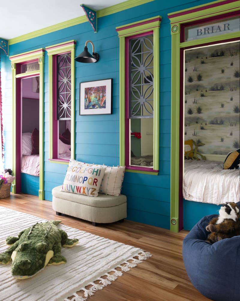 Turquoise and green kids room with 2 separate bed nooks