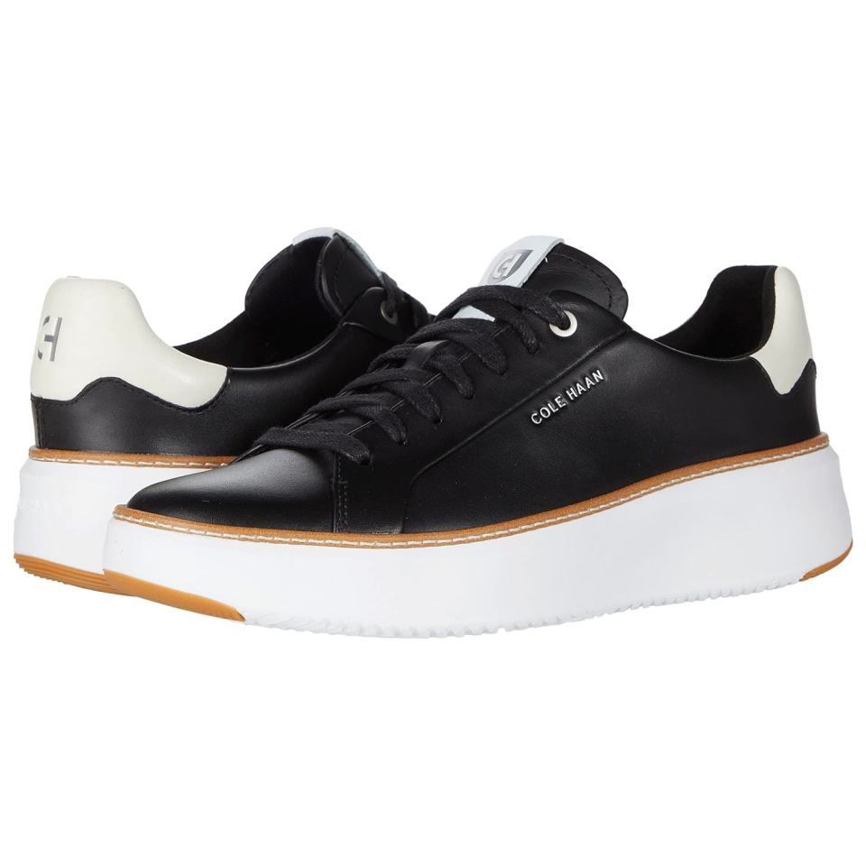 <p><a href="https://go.redirectingat.com?id=74968X1596630&url=https%3A%2F%2Fwww.zappos.com%2Fp%2Fcole-haan-grandpro-topspin-sneaker-ivory-black-leather%2Fproduct%2F9482440&sref=https%3A%2F%2Fwww.cosmopolitan.com%2Fstyle-beauty%2Ffashion%2Fg46286942%2Fbest-sneakers-for-wide-feet%2F" rel="nofollow noopener" target="_blank" data-ylk="slk:Shop Now;elm:context_link;itc:0;sec:content-canvas" class="link ">Shop Now</a></p><p>GrandPro TopSpin Sneaker </p><p>zappos.com</p><p>$129.00</p>