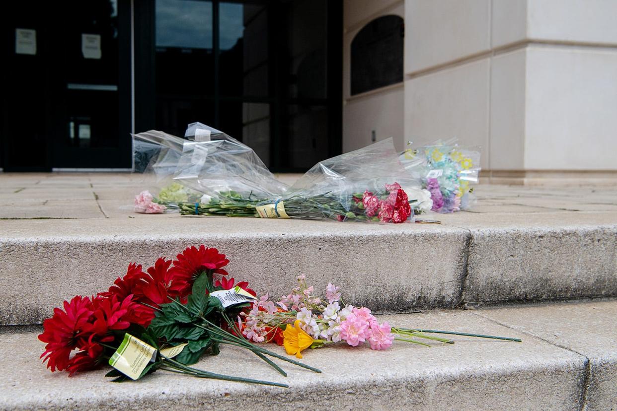 Flowers were placed near the doorway to the Charlotte-Mecklenburg Police Department at 601 E Trade St. in Charlotte, N. C., on April 30, 2024.