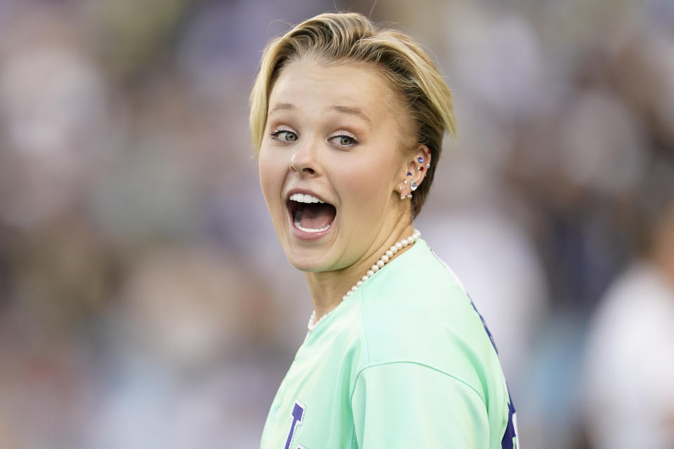 Jojo Siwa interacts with fans during the MLB All Star Celebrity Softball game, Saturday, July 16, 2022, in Los Angeles. (AP Photo/Abbie Parr)