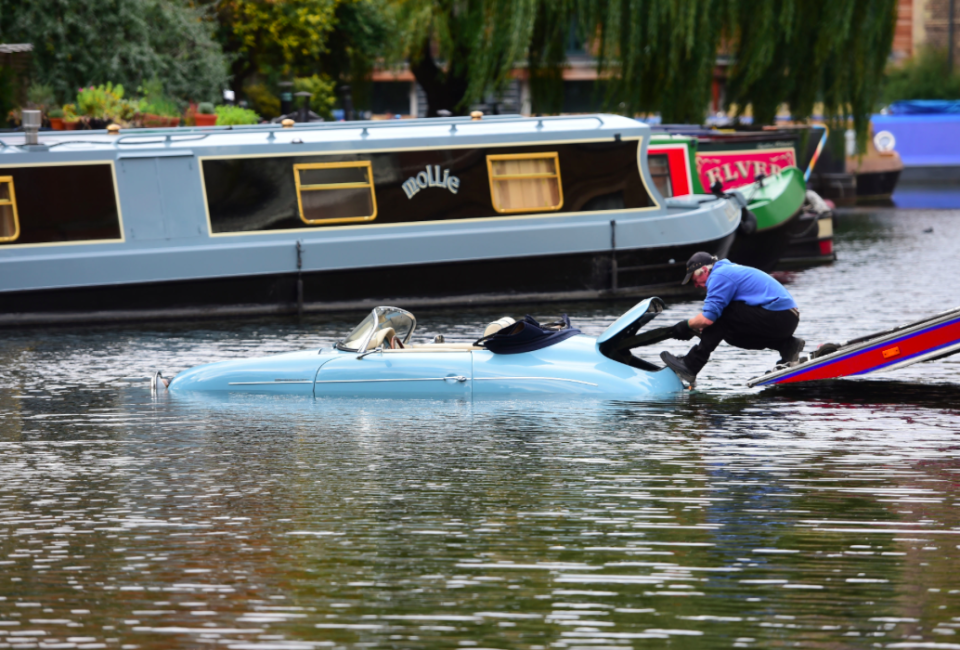 <em>The luxury car came to a watery end after being accidentally knocked into a neighbouring canal (PA)</em>