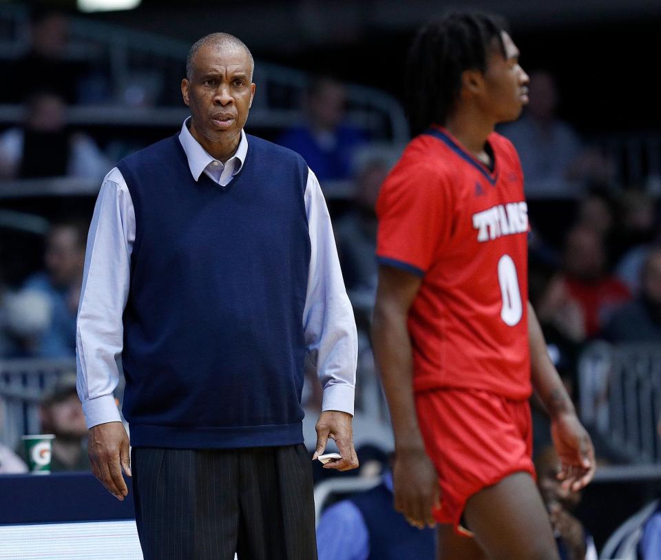 Detroit Mercy Titans head coach Mike Davis looks at his son Antoine Davis (0) after he received a technical foul in the second half of their game at Hinkle Fieldhouse on Monday, Nov. 12, 2018.