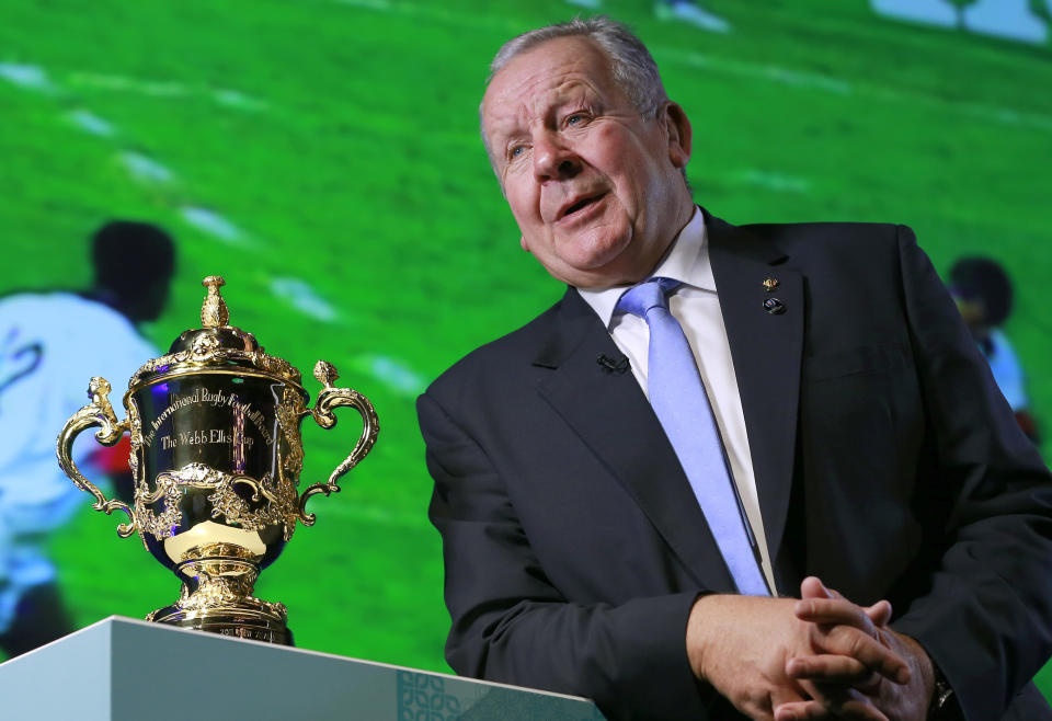 FILE - In this Thursday, Nov. 2, 2017 file photo, World Rugby Chairman Bill Beaumont speaks beside the Webb Ellis Cup during an interview before the match schedule announcement for the 2019 Rugby World Cup in Tokyo. Bill Beaumont and Agustin Pichot are vying to become chairman of World Rugby amid trying times for the sport because of the coronavirus outbreak and the growing discussion about a global calendar to unify the international game. (AP Photo/Shizuo Kambayashi, File)