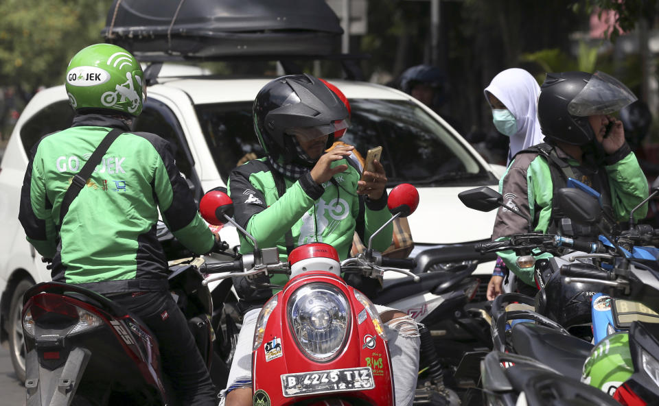 Go-Jek bike-taxi drivers wait for customers in Jakarta, Indonesia. (File photo: AP/Achmad Ibrahim)