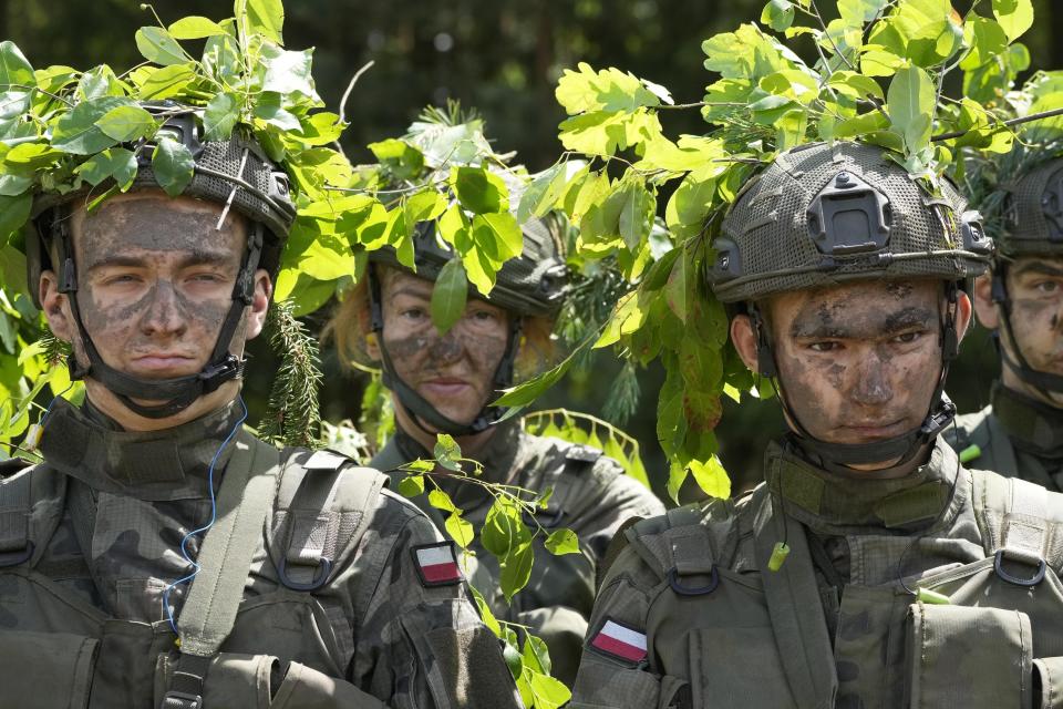 Volunteers takes part in basic training with the Polish army in Nowogrod, Poland, on Thursday June 20, 2024. Poland’s army has launched a program this summer called “Holidays with the Army” to train young volunteers in combat. Nations along NATO’s eastern flank are strengthening their defenses while fearing that Russia could one day attack them if it prevails in neighboring Ukraine. (AP Photo/Czarek Sokolowski)