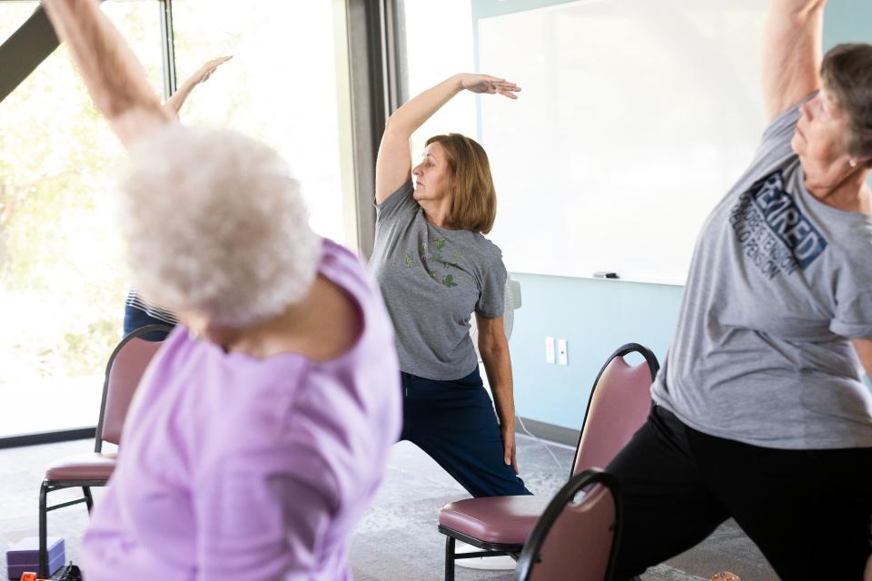 Daline Rostron, center, leads Joyce Jackson, left, and Suzanne Butterworth in a yoga class at at the Midvale Senior Center in Midvale on Friday, June 30, 2023. Yoga is one activity offered at the center. | Megan Nielsen, Deseret News