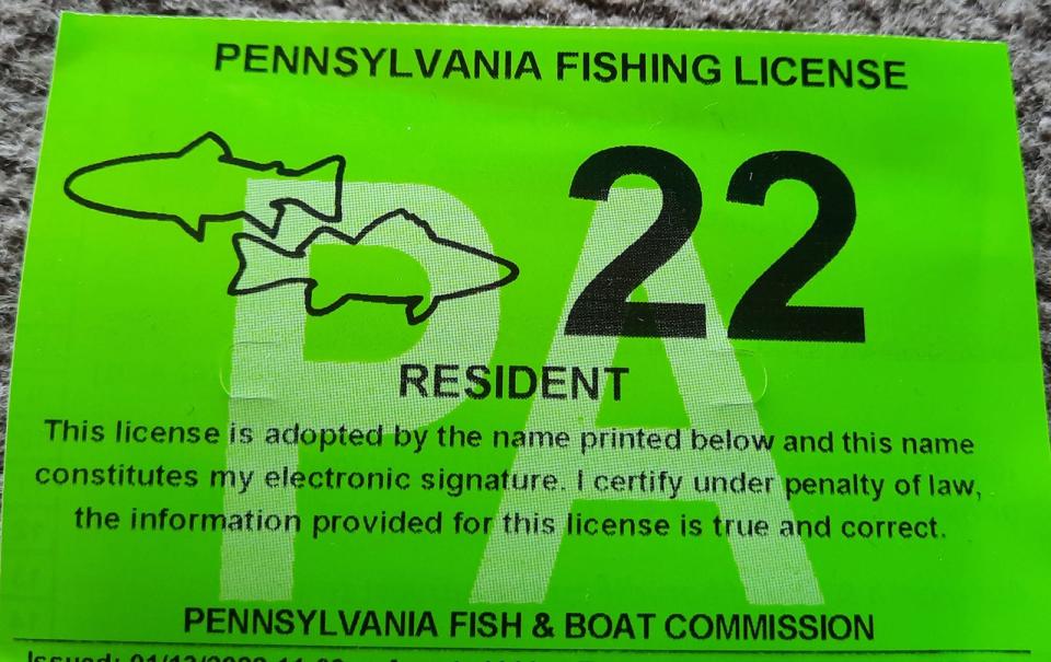 This is a 2022 Pennsylvania Fishing License, including a trout and Lake Erie Combination permit symbolized by the two fish. The Pennsylvania Fish and Boat Commission is considering a $2.50 increase to the cost of a general license and trout stamp.
