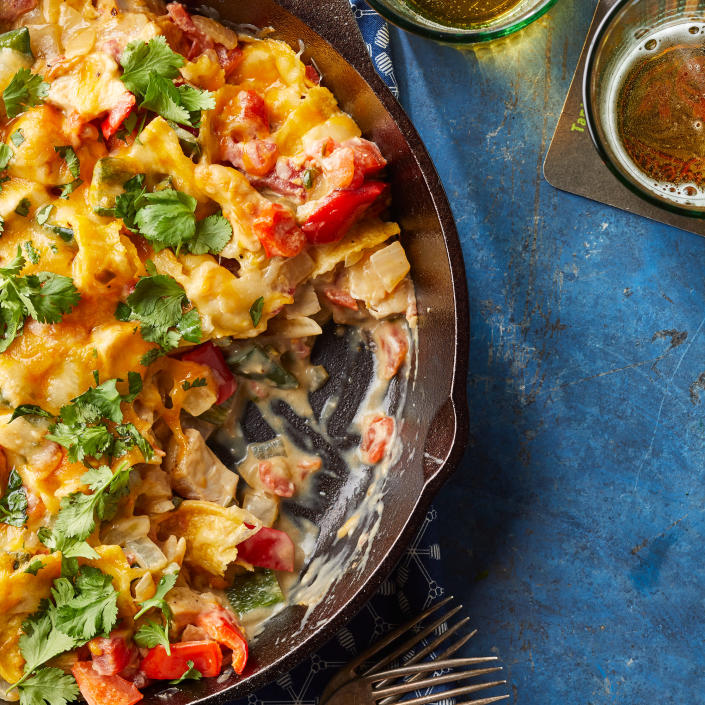 <p>Usually made by layering creamy chicken and tortillas (lasagna-style), this classic Tex-Mex chicken casserole gets speedier for an easy weeknight dinner when we mix everything together in a skillet, then pop the whole pan under the broiler to make the cheese topping gooey. <a href="https://www.eatingwell.com/recipe/270475/quick-king-ranch-chicken-casserole/" rel="nofollow noopener" target="_blank" data-ylk="slk:View Recipe" class="link ">View Recipe</a></p>