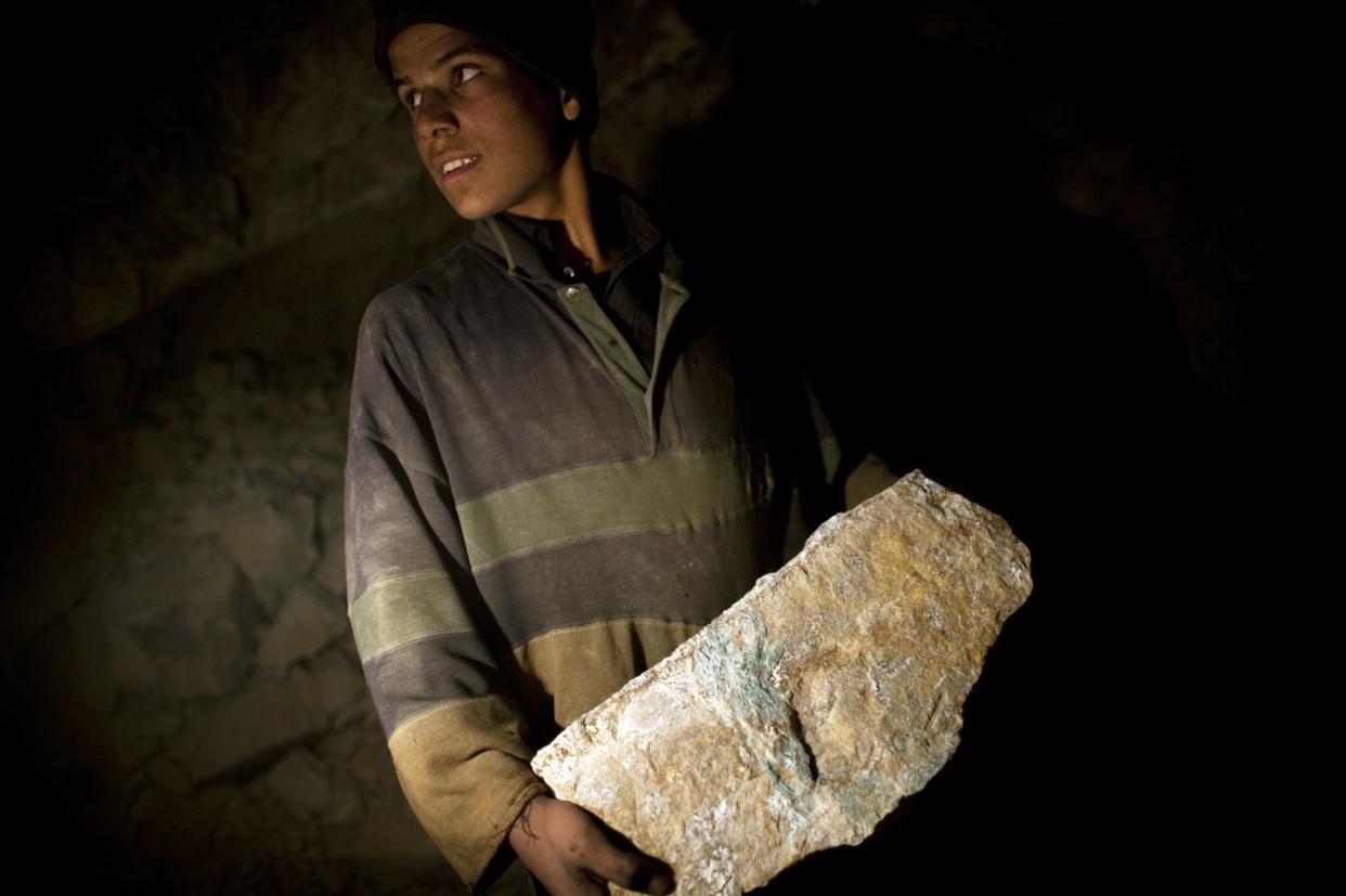 <span class="caption">Afghanistan has mineral resources that include precious gems and minerals such as copper and rare earth elements.</span> <span class="attribution"><a class="link " href="https://www.gettyimages.com/detail/news-photo/an-afghan-miner-works-in-a-makeshift-emerald-mine-in-the-news-photo/102915792?adppopup=true" rel="nofollow noopener" target="_blank" data-ylk="slk:Majid Saeedi/Getty Images;elm:context_link;itc:0;sec:content-canvas">Majid Saeedi/Getty Images</a></span>
