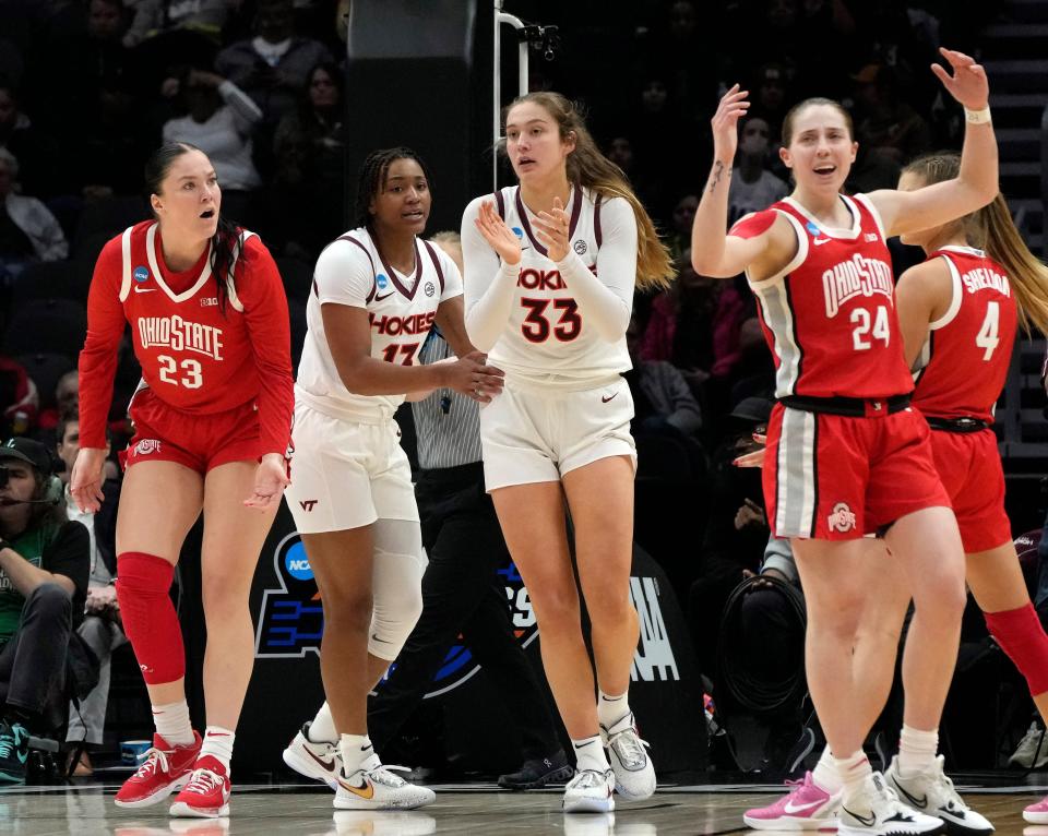 Virginia Tech center Elizabeth Kitley (33) celebrate after a foul was called against Ohio State during their 2023 NCAA tournament game at Climate Pledge Arena in Seattle.