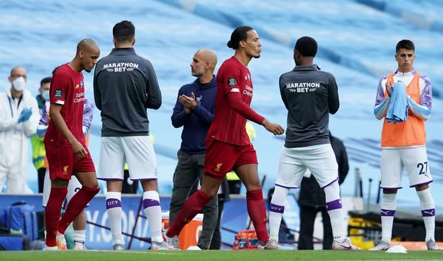 Liverpool are given a guard of honour by former champions Manchester City. The Reds arrived at the Etihad Stadium with the title sewn up after City lost 2-1 at Chelsea in their previous league match. Virgil Van Dijk and Fabinho, pictured, had endured an evening to forget as Pep Guardiola's hosts exacted a modicum of revenge with a thumping 4-0 success