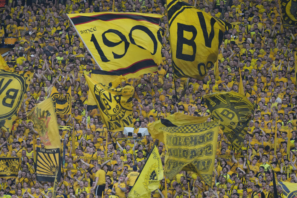 Supporters cheer before the Champions League semifinal first leg soccer match between Borussia Dortmund and Paris Saint-Germain at the Signal-Iduna Park stadium in Dortmund, Germany, Wednesday, May 1, 2024. (AP Photo/Matthias Schrader)