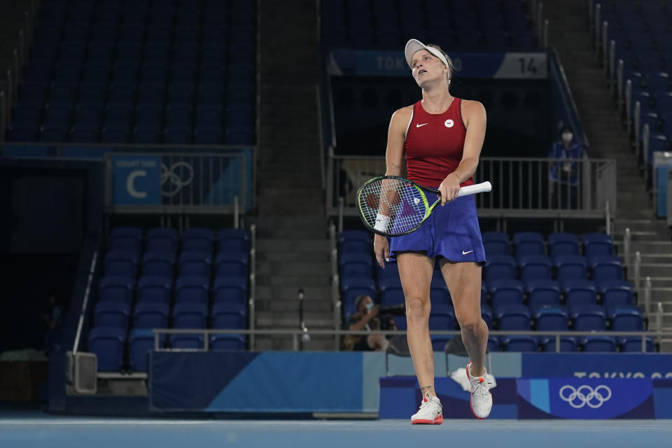 Marketa Vondrousova, of the Czech Republic, reacts during the women's gold medal match of the tennis competition against Belinda Bencic, of Switzerland, at the 2020 Summer Olympics, Saturday, July 31, 2021, in Tokyo, Japan. (AP Photo/Seth Wenig)