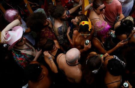 Revellers take part in an annual block party known as "Ceu na Terra" (Heaven on Earth), one of the many carnival parties to take place in the neighbourhoods of Rio de Janeiro, Brazil February 25, 2017. REUTERS/Ricardo Moraes