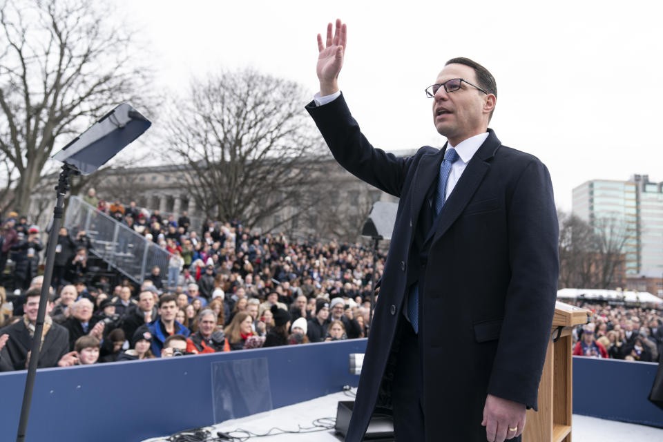 Democratic Gov. Josh Shapiro waves to the audience after taking the oath of office to become Pennsylvania's 48th governor, Tuesday, Jan. 17, 2023, at the state Capitol in Harrisburg, Pa. (AP Photo/Matt Rourke)