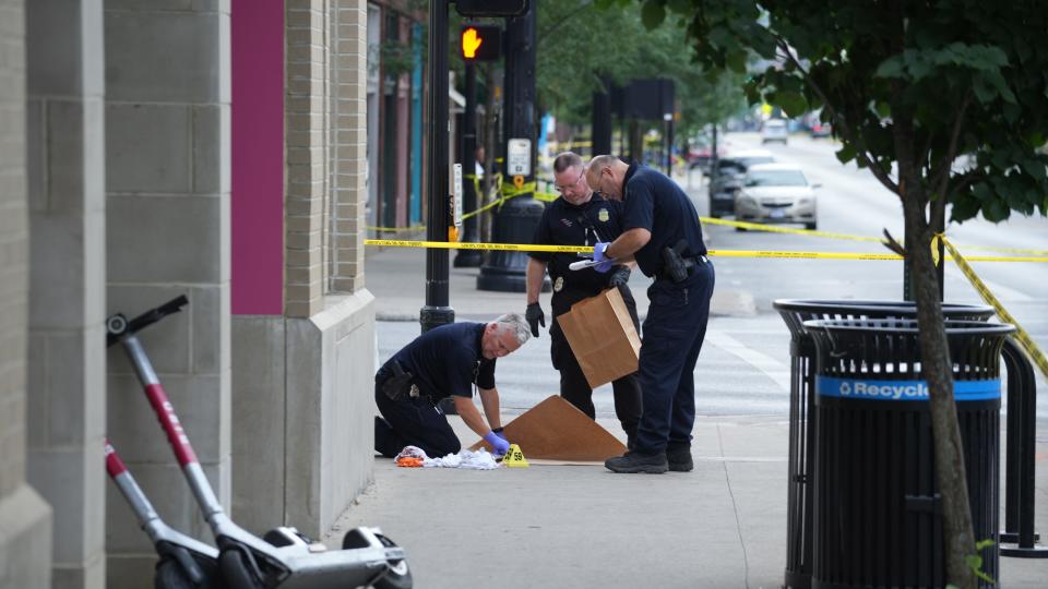 Columbus police investigators collect evidence at N. High St. and E. Fifth Ave after 10 people were shot in the Short North area of Columbus overnight. The shooting was reported about 2:30 AM and one of the 10 victims was in critical condition and the others were stable, police told 10TV.