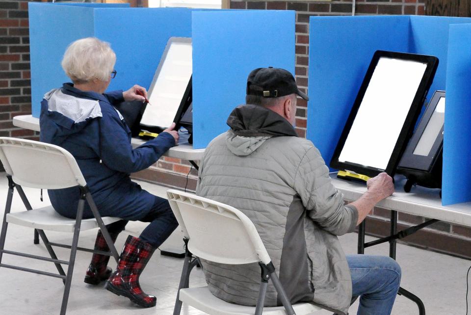 Deborah and Gerald Baroni vote in the Murray Hall polling place in Creston during the May 3 Primary.