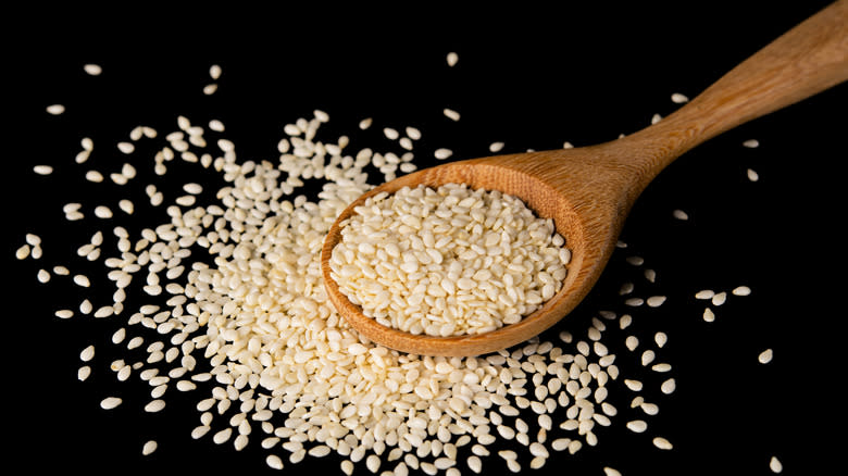 Sesame seeds in a wooden spoon