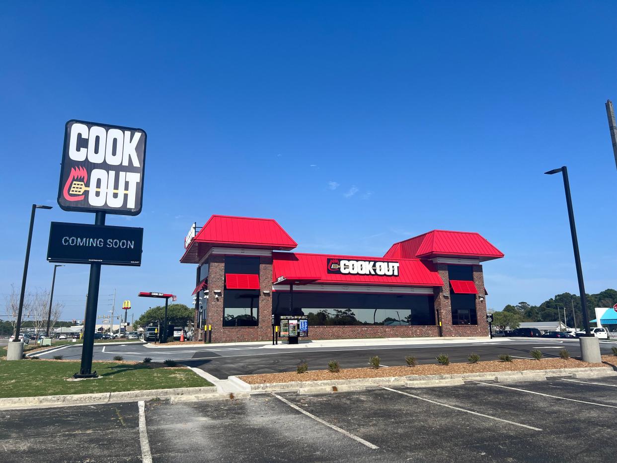 The Cook Out restaurant near Southport displays a "coming soon" sign on Tuesday, April 2, 2024.