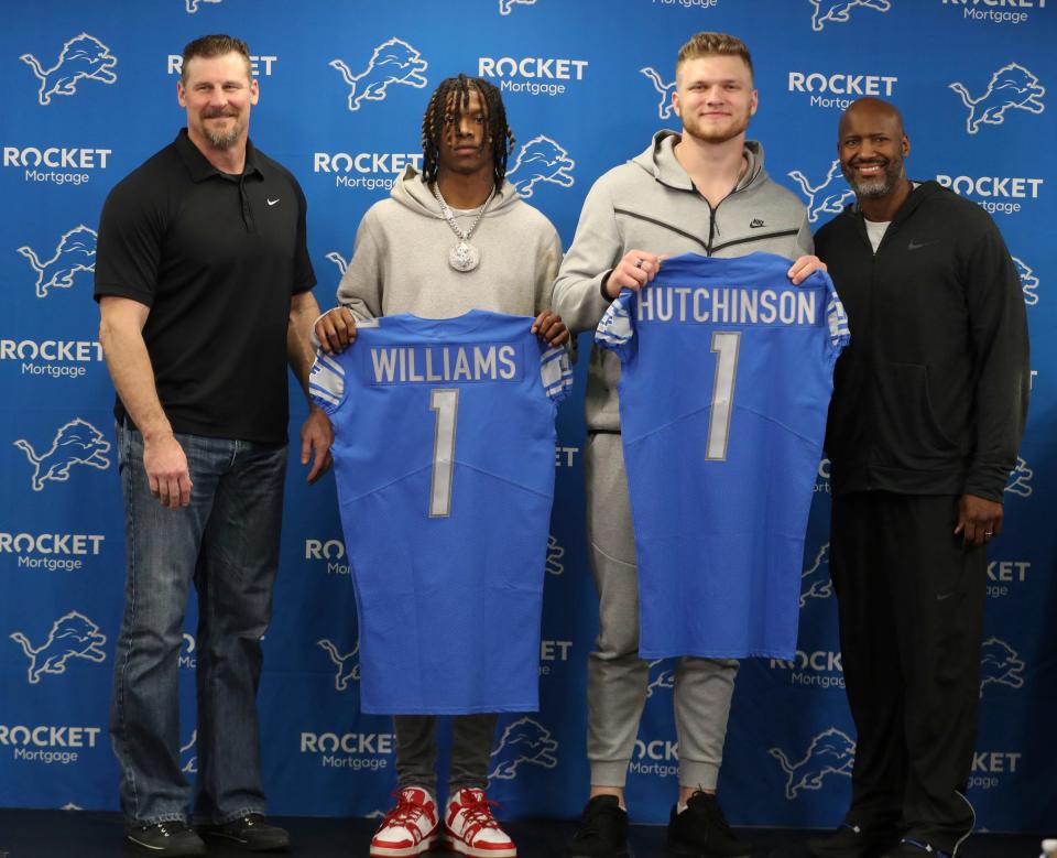 Detroit Lions head coach Dan Campbell, first round picks receiver Jameson Williams and defensive end Aidan Hutchinson pose for a picture with GM Brad Holmes during the news conference Friday, April 29, 2022 at the Detroit Lions practice facility in Allen Park.