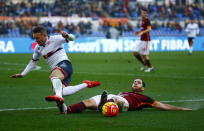 Football Soccer - AS Roma v Genoa - Italian Serie A - Olympic Stadium, Rome, Italy - 20/12/15. AS Roma's Kostas Manolas and Genoa's Diego Capel in action. REUTERS/Tony Gentile