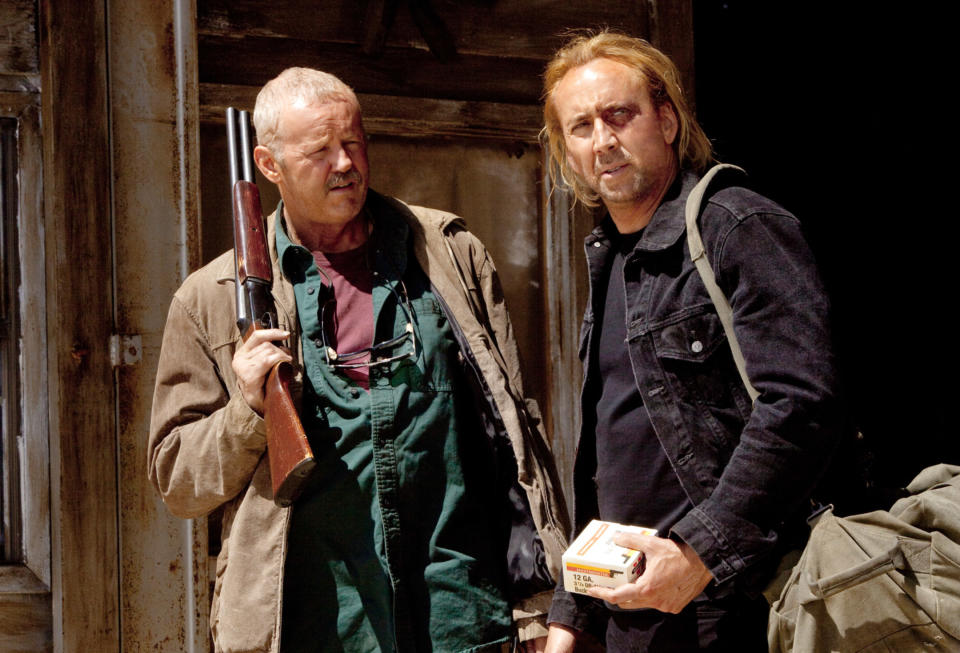 David Morse and Nicolas Cage talking.