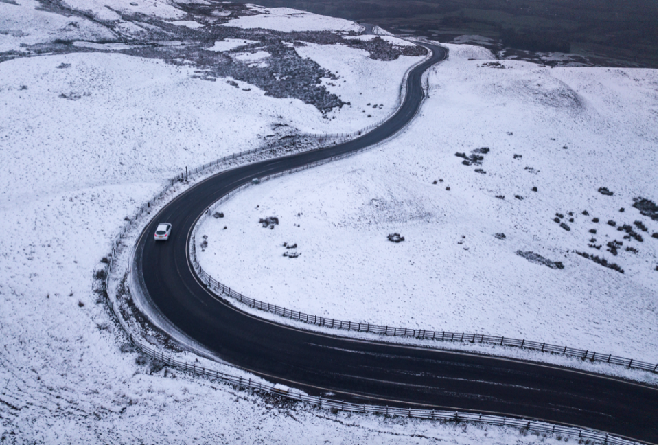 <em>A road winds through snow covered fields near Hope Valley, Derbyshire (SWNS)</em>