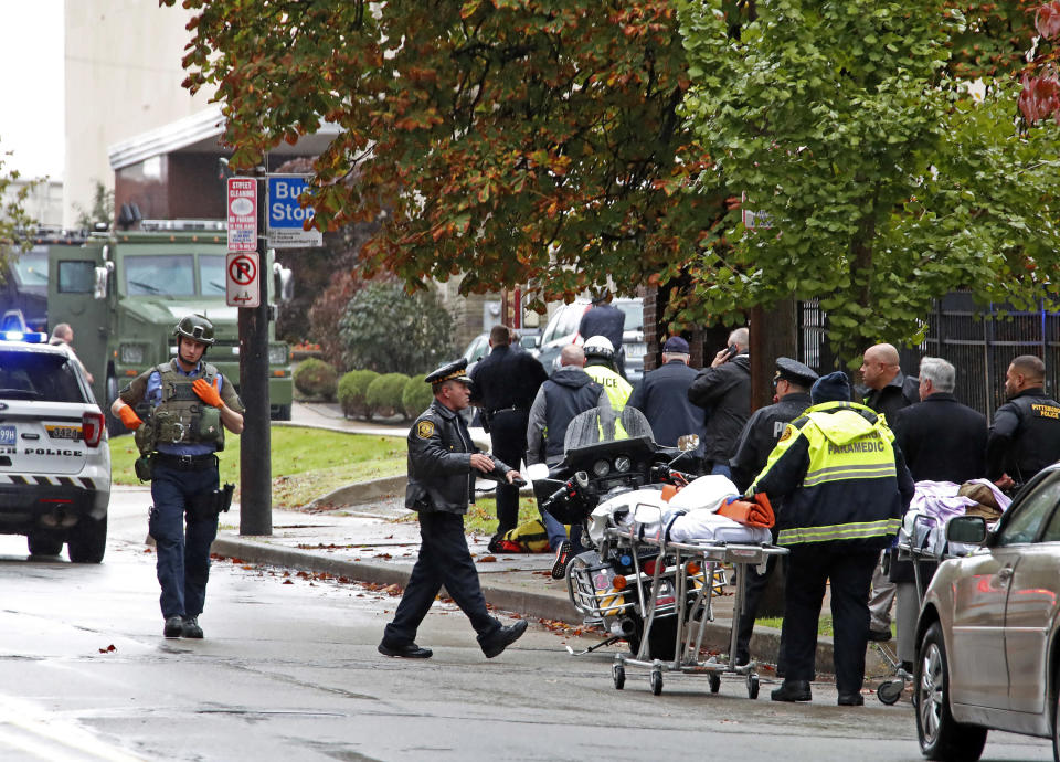 FILE - In this Oct. 27, 2018 file photo, first responders surround the Tree of Life Synagogue, rear center, in Pittsburgh, where a shooter opened fire and 11 people were killed in America's deadliest antisemitic attack. The long-delayed capital murder trial of Robert Bowers in the 2018 Pittsburgh synagogue massacre will begin with jury selection beginning April 24, 2023, a federal judge has ruled. (AP Photo/Gene J. Puskar, File)