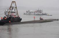 A rescue team works next to the Dongfangzhixing or "Eastern Star" vessel which sank in the Yangtze river in Jianli on June 2, 2015