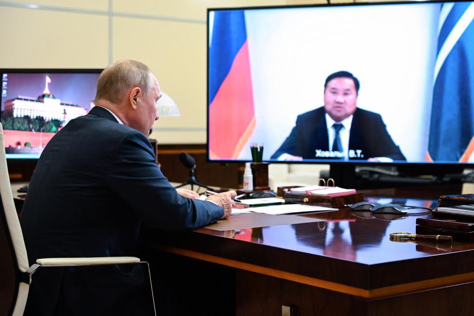 Russian President Vladimir Putin listens during a meeting with acting head of the Republic of Tuva Vladislav Khovalyg via video conference at the Novo-Ogaryovo residence outside Moscow, Russia, Thursday, Aug. 12, 2021. (Alexei Nikolsky, Sputnik, Kremlin Pool Photo via AP)